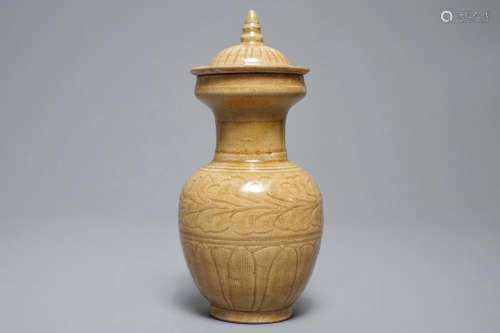 A Chinese brown glazed vase and covers with floral anhua design, Song or later