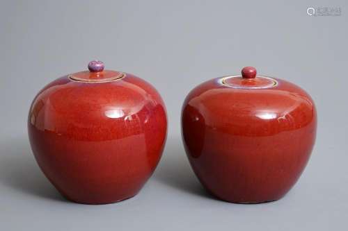 A pair of Chinese monochrome oxblood-glazed jars and covers, 19th C.