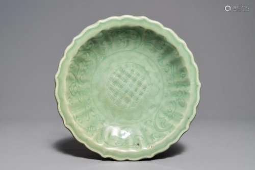 A Chinese Longquan celadon dish with underglaze design, Ming