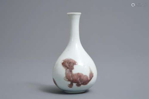 A Chinese copper-red bottle vase with mythical creatures, Kangxi