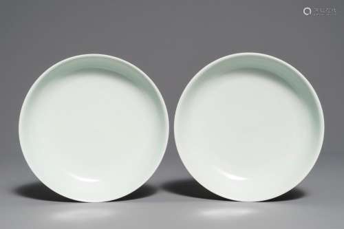 A pair of Chinese pale celadon anhua-decorated plates, Qianlong mark, 19/20th C