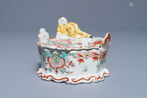 A polychrome Dutch Delft petit feu and doré butter tub with a reclining Chinaman, 18th C.