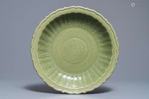 A Chinese Longquan celadon dish with underglaze floral design, Ming