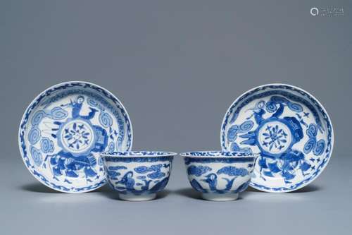 A pair of Chinese blue and white French market cups and saucers with texts, Kangxi