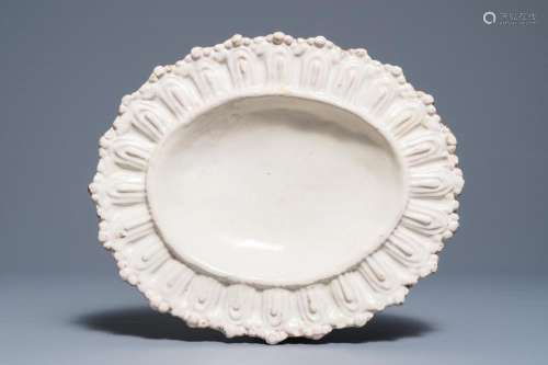 An Italian maiolica gadrooned oval monochrome white dish, Faenza, 17th C.