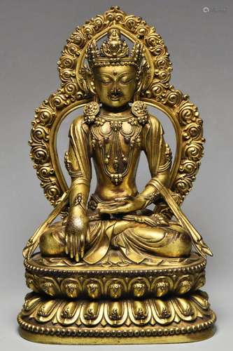 A MING GILT BRONZE GUANYIN YONGLE MARK AND PERIOD