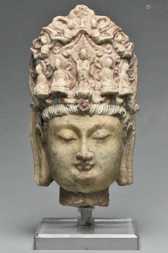 A TANG DYNASTY LIMESTONE HEAD OF BUDDHA AND STAND