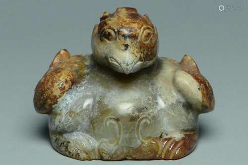 A HAN DYNASTY CELADON AND RUSSET JADE BIRD