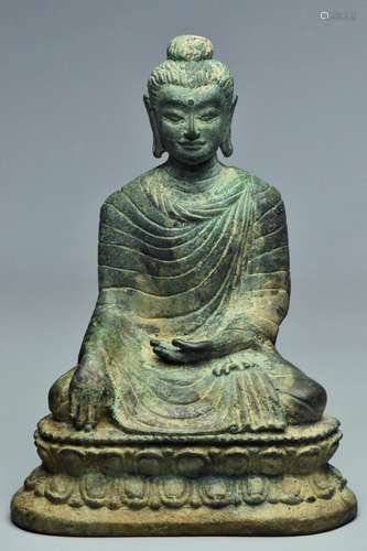 A TANG DYNASTY BRONZE FIGURE OF BUDDHA