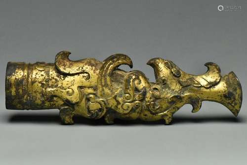 A WARRING STATES PERIOD GILT SWORD HANDLE PHOENIX