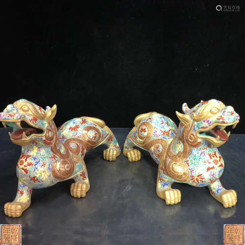 PAIR FAMILLE-ROSE AUSPICIOUS BEAST SHAPED FIGURES