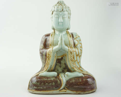 A UNDERGLAZE RED FIGURE OF BUDDHA