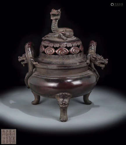A BRONZE MOLDED TRIPOD CENSER WITH MARK