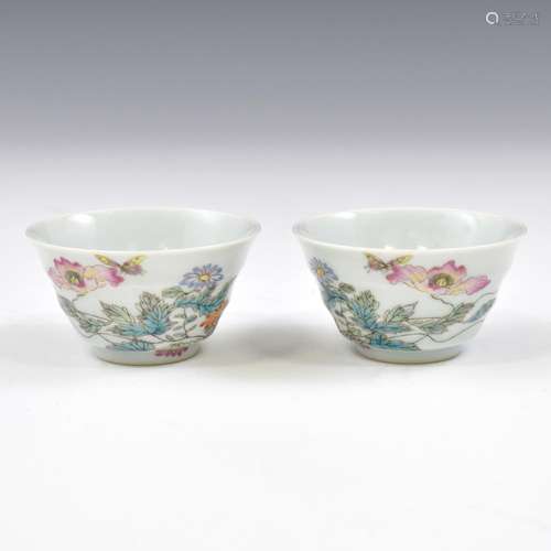 PAIR OF BUTTERFLY OVER BLOOMS PORCELAIN CUPS