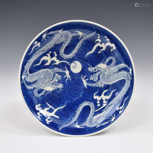 A KANGXI REVERSE DECORATED BLUE DRAGON PLATE