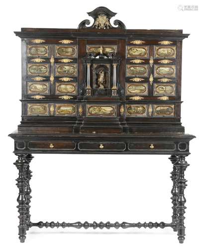 An Italian Baroque style ebonised cabinet, with brass mounts and ripple mouldings, with a scroll