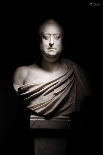 An early 19th century marble bust of a gentleman, wearing a classical toga, 72.4cm high, 63.5cm