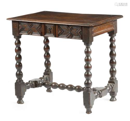 A William and Mary oak side table, the boarded top above a geometric moulded frieze drawer, on