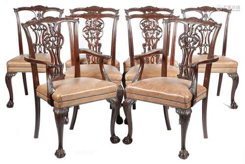 A set of eight mahogany dining chairs in Chippendale style, each with a leaf and scroll carved