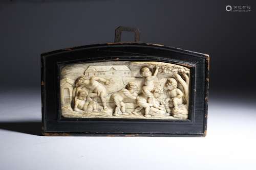 λ A European ivory panel, carved in relief with cavorting cherubs picking fruit from a tree, with