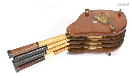 A late Victorian mahogany tennis racquet holder, with a brass sunken handle and applied with a white