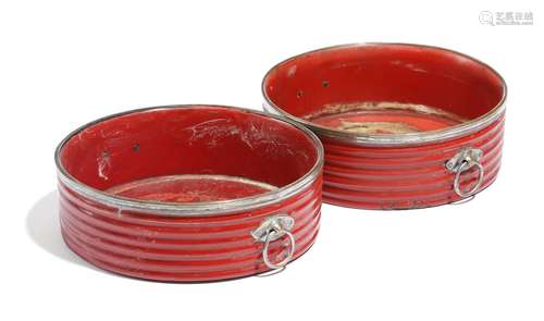 A pair of Regency red papier-mâché wine coasters, with old Sheffield plate mounts, with reeded