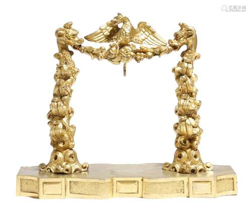 A 19th century gilt bronze watch stand, with an eagle surmount and with mythical beasts supporting a