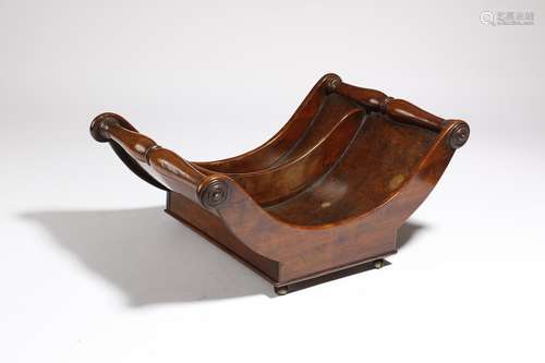 A George III mahogany cheese coaster, of dipped form, with baluster turned lifts and a divided