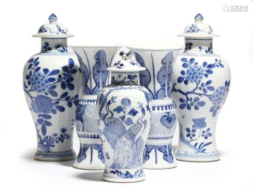 A small pair of Chinese porcelain blue and white yen-yen vases, together with a pair of blue and