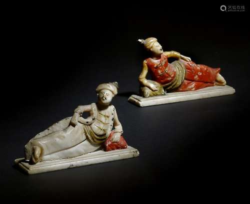 A pair of Dutch alabaster finials of reclining Turkish figures, with polychrome decoration, late