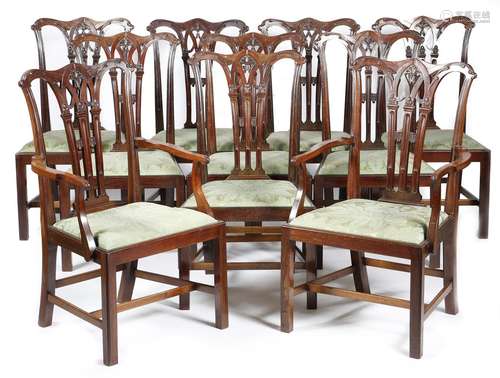 A set of ten mahogany dining chairs in Chippendale style, each with a leaf carved stop fluted