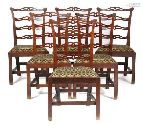 A set of six George III mahogany dining chairs, each with a pierced ladder back, on moulded and