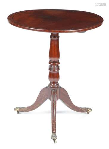 A Regency mahogany tripod occasional table, the circular tilt-top inlaid with ebony stringing and