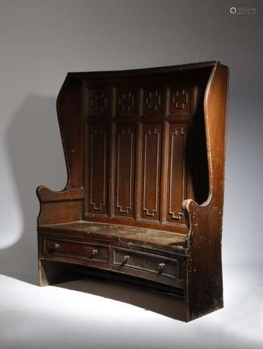 A 19th century painted and grained pine concave settle, the panelled back with cross shape outline
