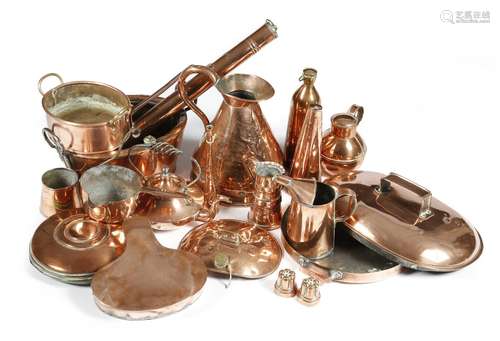 A collection of copper ware, including: two small jelly moulds, a kettle, warmers, a haystack