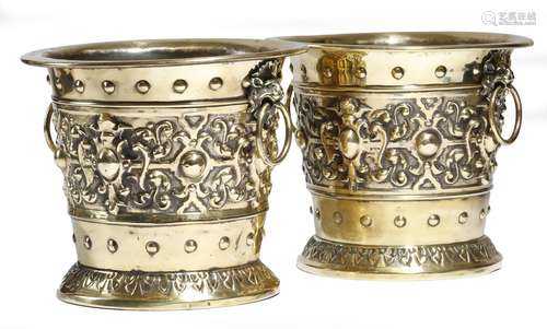 A pair of late 19th century Dutch brass jardinières, each decorated with cartouches, on a