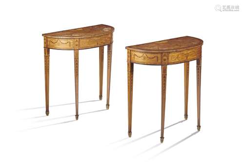 λ A pair of satinwood and marquetry console tables in Sheraton style, each with rosewood