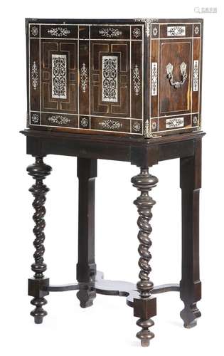 λ A late 17th century North Italian ebony and ivory table cabinet, inlaid with marquetry panels of