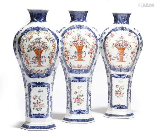 A set of three Chinese porcelain famille rose flattened baluster vases, with underglaze blue