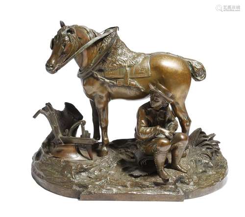 A 19th century French bronze group of a seated farmer, with his horse, on a naturalistic base, 26.