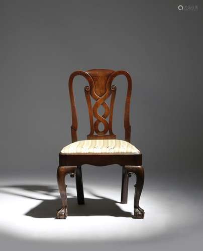 A George II Irish mahogany side chair, with a scrolled interlaced splat, above a drop-in seat, on