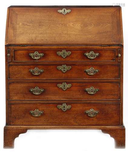 An early George III mahogany bureau, the hinged fall revealing a bank of seven drawers and