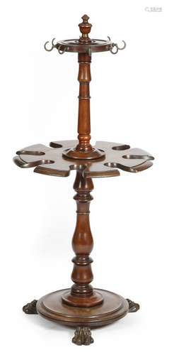 A William IV mahogany whip and boot stand in the manner of Gillows, with an urn finial, above two