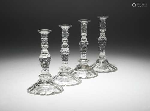 A closely matched set of four cut-glass tapersticks in 18th century style, each with a faceted