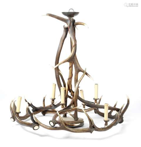 An antler six-light chandelier, of open crown form, with an opaque glass shade, 90.9cm high, 94cm