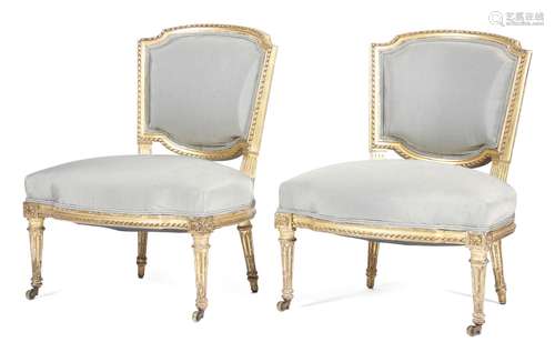 A pair of 19th century giltwood nursing chairs, each with a padded back and seat upholstered with