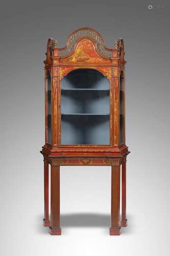 An 18th century Dutch red japanned display cabinet on later stand, of canted form, decorated in gilt