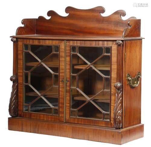 A William IV mahogany table bookcase, the shaped gallery above a pair of geometric astragal glazed