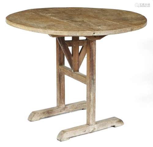 A French oak country wine tasting table or vendange table, the circular boarded top on sleigh