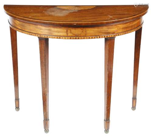 A mahogany console table in George III style, the crossbanded top inlaid with a fan motif, the